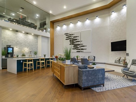 a living room with a couch and a table with chairs